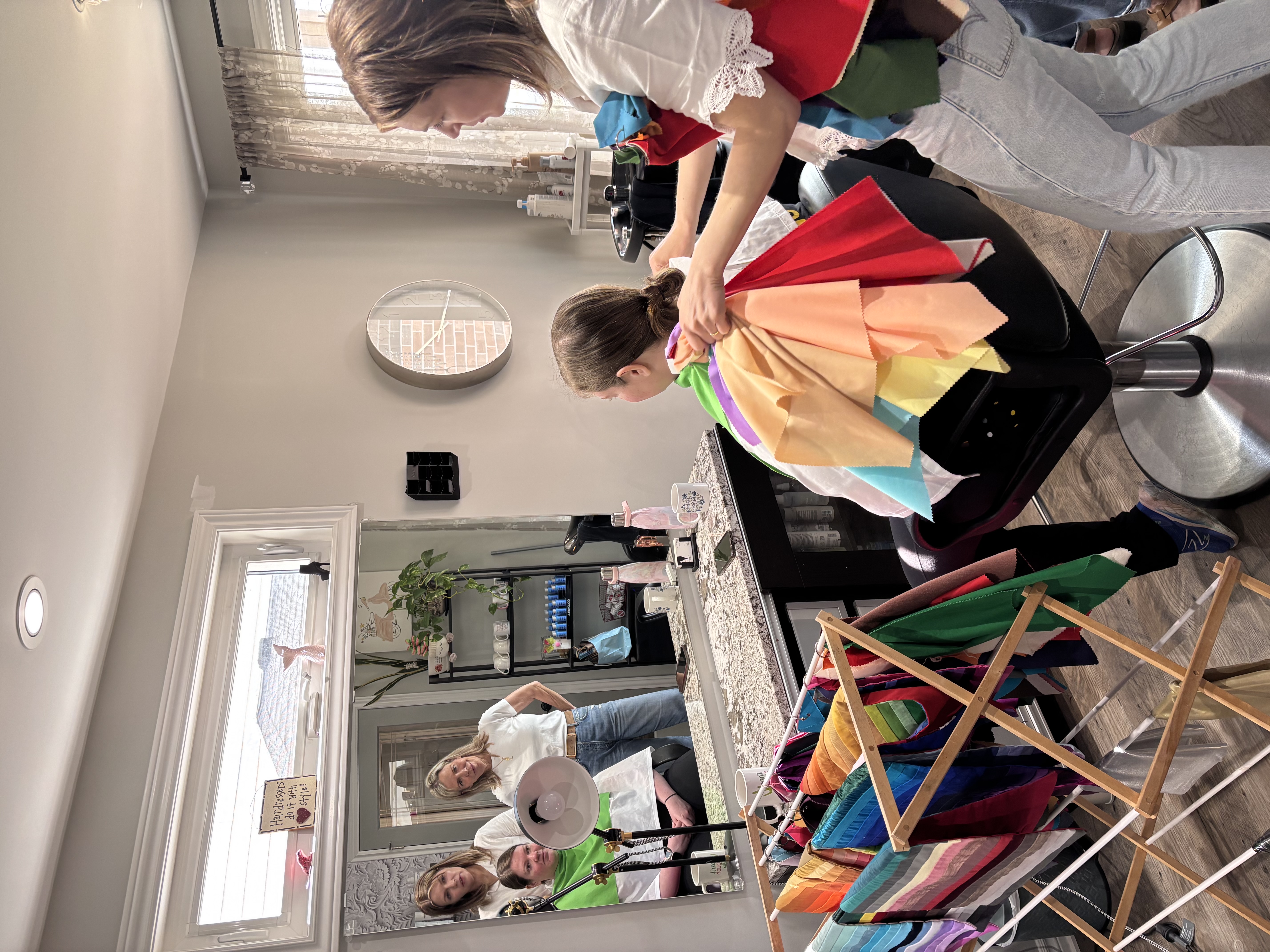 Krista performing a live colour analysis draping session with fabric swatches